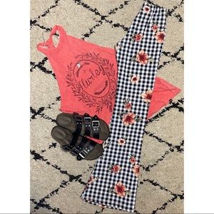 Xs rose, black and white hippie bell bottoms.